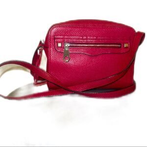 Small Red Rebecca Minkoff messenger crossbody purse with fringe and zipper